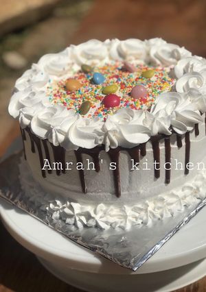 A picture of Chocolate cake with whipped cream frosting.