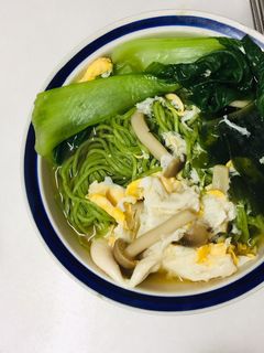 A picture of Spinach noodle vegetable miso soup.