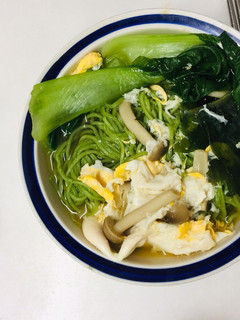 A picture of Spinach noodle vegetable miso soup.