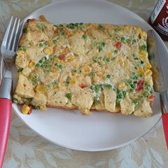 A picture of Vegetable Omelet with Bread.