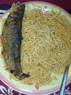 A picture of Spagetti with fish.