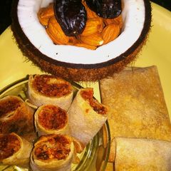 A picture of Dates with coconut roll in chapati (sweeten roll).