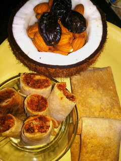 A picture of Dates with coconut roll in chapati (sweeten roll).