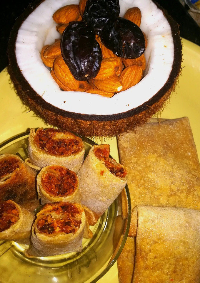 A picture of Dates with coconut roll in chapati (sweeten roll).