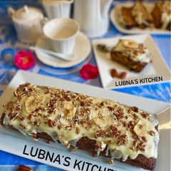 A picture of BANANA cake with cream cheese frosting :.