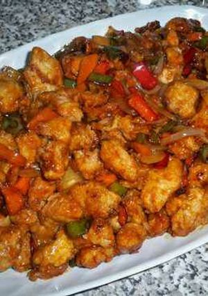 Una foto de Pollo agridulce capeado con verduras