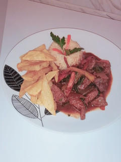 Una foto de Lomo Saltado