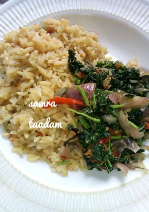 A picture of Jollofrice with spinach sauce.