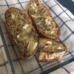 A picture of Oven baked brie cheese on sour dough bread 🥖.