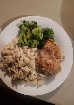A picture of Baked chicken breast with vinaigrette.