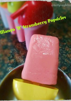 A picture of Mango N Strawberry Popsicles.