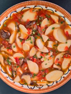 A picture of King Oyster Mushrooms in Tomato Sauce.