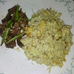 A picture of Zesty lemon beef or pork soy with asparagus and caulirice.