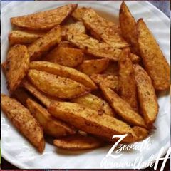 A picture of Masala Potato Wedges.