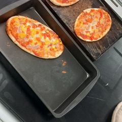 A picture of Simple cheese and Ham Pizza.