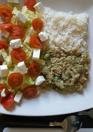 A picture of Lemon scented rice and tuna, with salad.