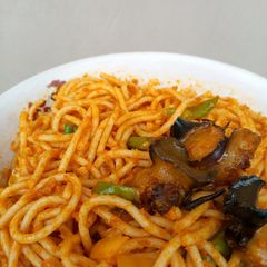 Fried Baby Snails On Mixed Veggies Jollof Pasta A picture of Fried Baby Snails On Mixed Veggies Jollof Pasta.