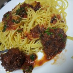A picture of Tumeric Spaghetti in meatball sauce.