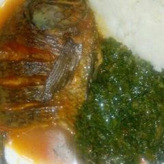 A picture of Ugali Fish stew and kales.