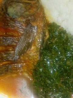 A picture of Ugali Fish stew and kales.