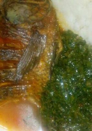 A picture of Ugali Fish stew and kales.