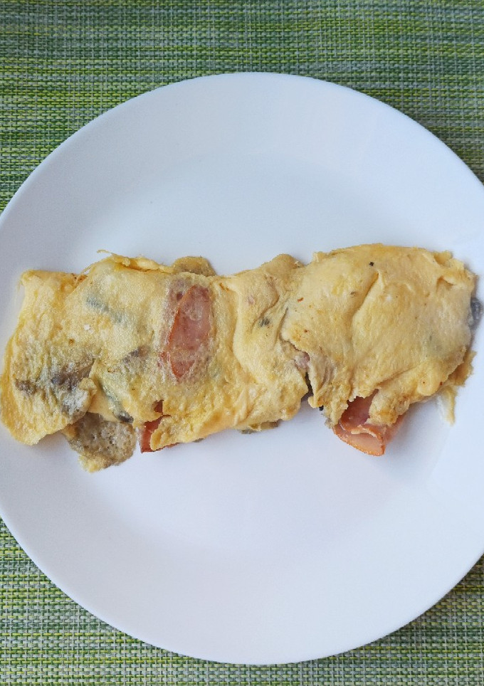 Una foto de Tortilla de jamón y champiñones