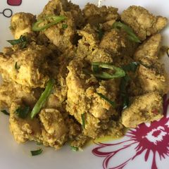 A picture of Green tomatoes chicken karahi.