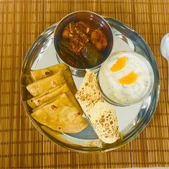 A picture of Mini Kathiyawadi Meal- Bharela (Ravaya)Ringana- Bateta nu Shaak-Fulka Rotli😋.