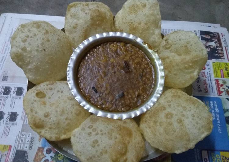 Luchi cholar daal (puri and chana daal)