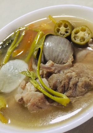 A picture of Pork Ribs & Water Spinach in Tamarind Broth - Filipino Sinigang.
