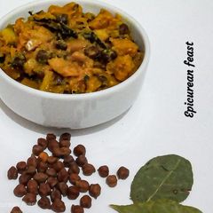 A picture of Kumror Chakka Vegan pumpkin curry with black chickpeas.