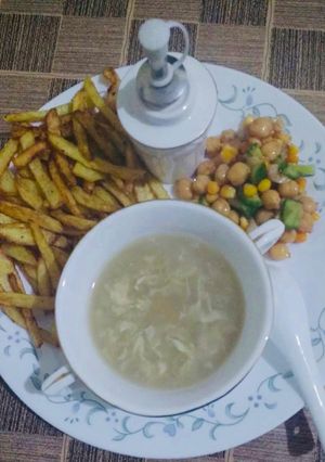 A picture of Chicken corn soup & chikpea salad with french fries 🍟.