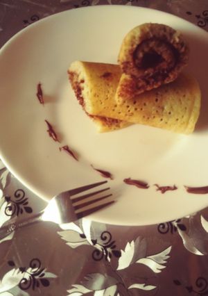 Une photo de Mille troux au nutella (crepes à la semoule)