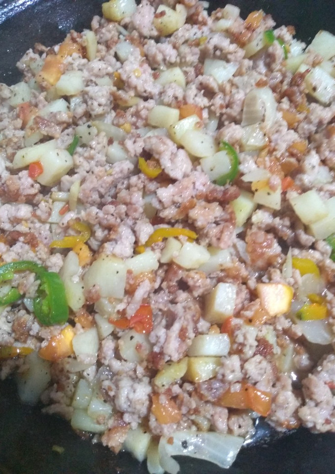 A picture of Pork Picadillo with Pico de Gallo and Potatoes.