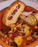 Zuppa di Pesce con tentacoli di calamari e crostini di pane