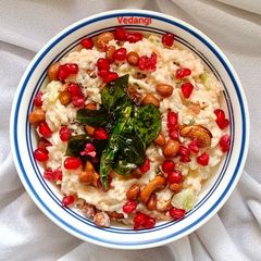 A picture of Curd Rice with veggies.