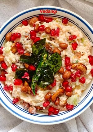 A picture of Curd Rice with veggies.