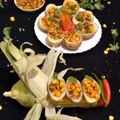 A picture of Jacket Potatoes with Buttery Corn Chaat Stuffing.