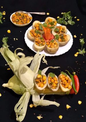 A picture of Jacket Potatoes with Buttery Corn Chaat Stuffing.