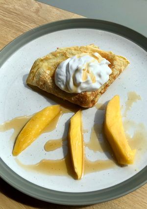 A picture of Mango & coconut yoghurt crepes.