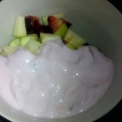 A picture of Fruit salad and yoghurt.