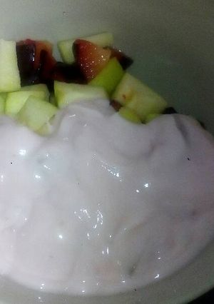 A picture of Fruit salad and yoghurt.
