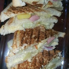 A picture of Vegetable and sausage sandwich.