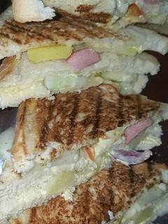 A picture of Vegetable and sausage sandwich.