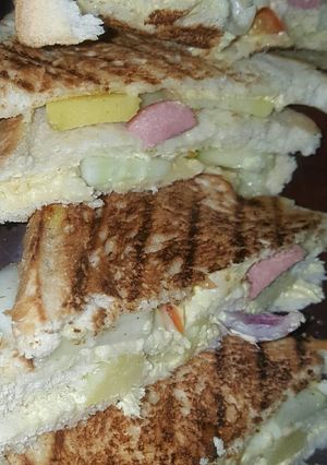 A picture of Vegetable and sausage sandwich.