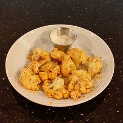 A picture of Romano Cheese Crusted Spicy Cauliflower Bites.