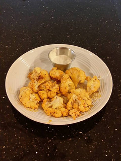 A picture of Romano Cheese Crusted Spicy Cauliflower Bites.
