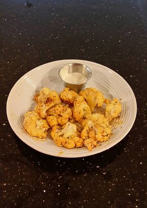 A picture of Romano Cheese Crusted Spicy Cauliflower Bites.
