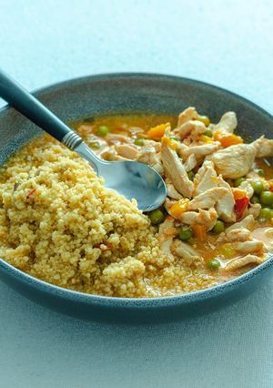 A picture of Chicken stew with peas.