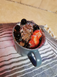 A picture of Chocolate Cake in a mug.